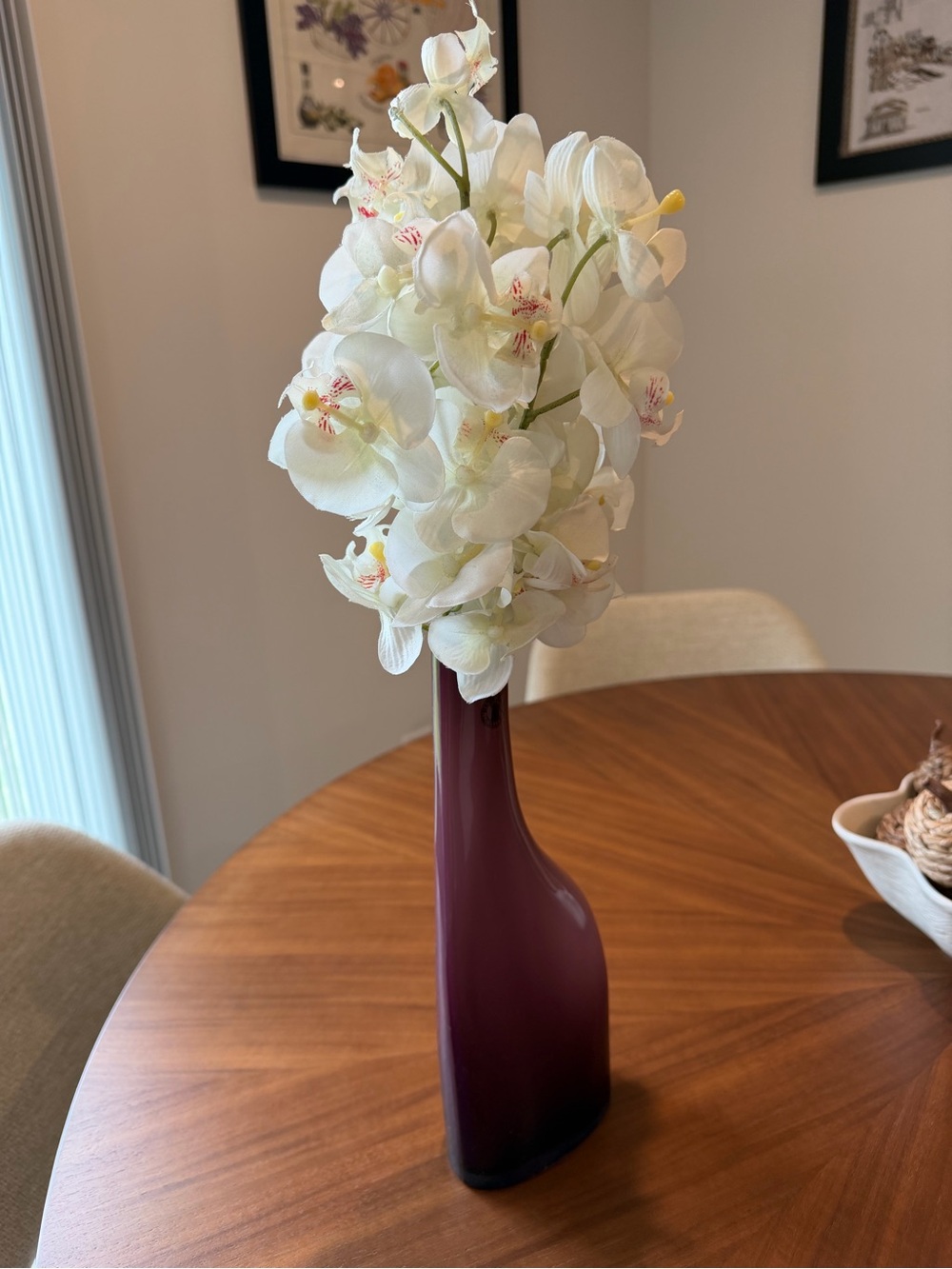 Purple IKEA vase with faux orchids